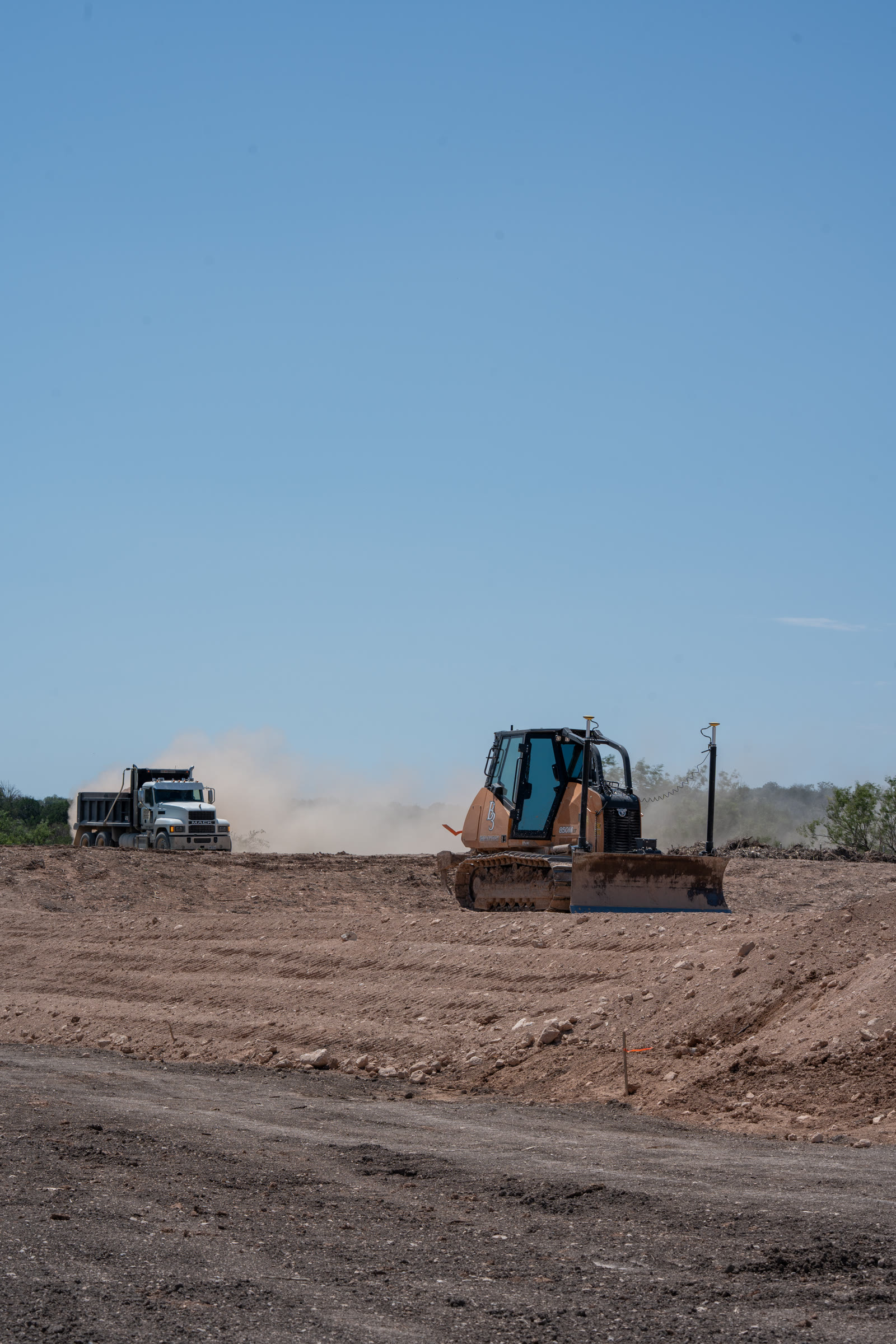 B3 dozer fine-grading a pad with Leica 3D GPS machine control